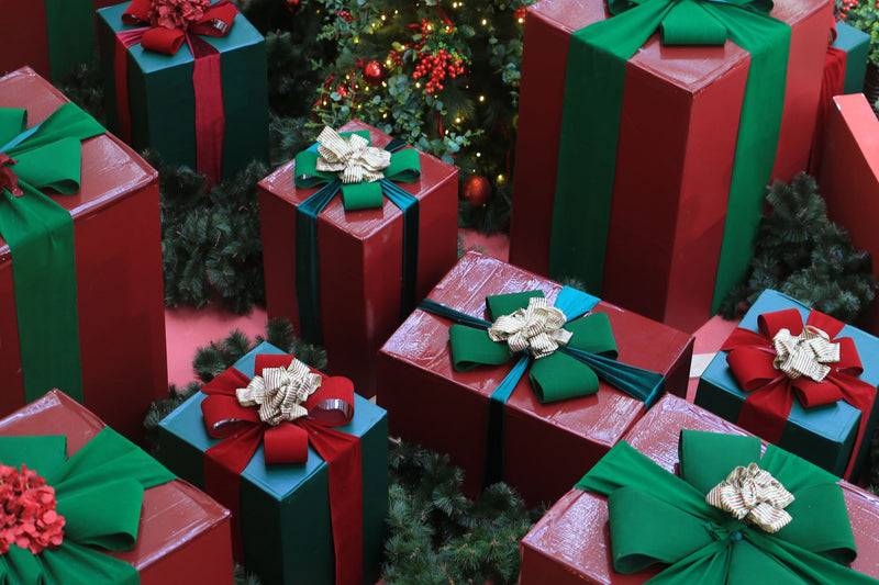 Red and green wrapped gift boxes from above